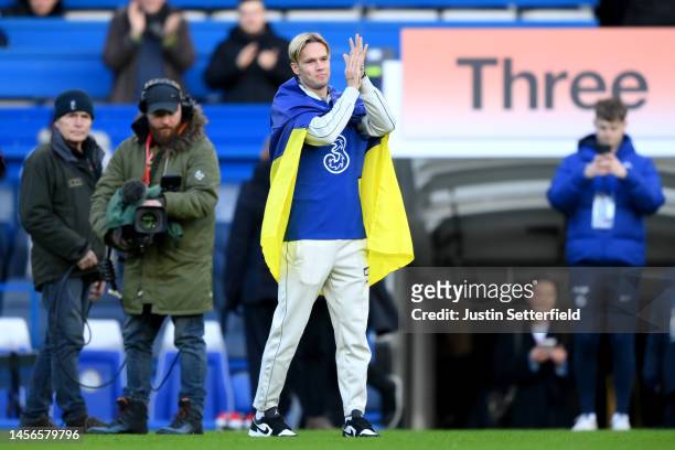 New Chelsea FC signing, Mykhaylo Mudryk applauds while being introduced to the fans on the pitch at half time during the Premier League match between...