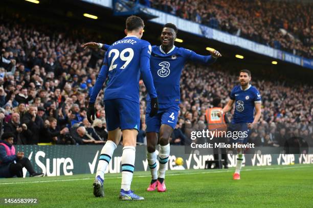 Kai Havertz of Chelsea celebrates with teammate Benoit Badiashile after scoring the team's first goal during the Premier League match between Chelsea...