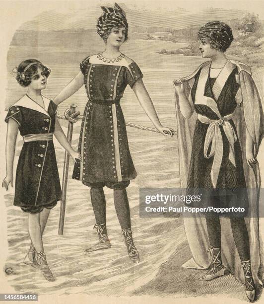 Plate from La Mode Illustree showing three young girls at the beach wearing bathing suits, the costumes are in blue serge trimmed with white braid...