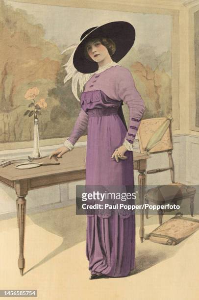Colour plate from La Mode Illustree showing a young woman wearing an empire line visiting gown by designer Laferriere, the gown is in pale purple...