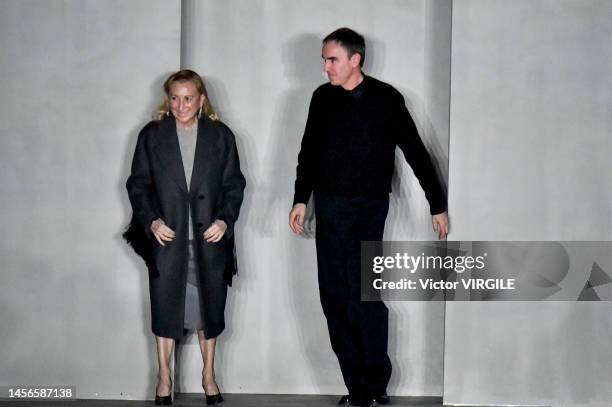 Fashion designers Miuccia Prada and Raf Simons walk the runway during the Prada Ready to Wear Fall/Winter 2023-2024 fashion show as part of the Milan...