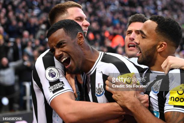 Alexander Isak of Newcastle United celebrates with teammates after scoring the team's first goal during the Premier League match between Newcastle...