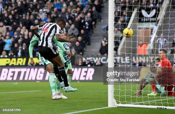 Alexander Isak of Newcastle United scores the team's first goal during the Premier League match between Newcastle United and Fulham FC at St. James...