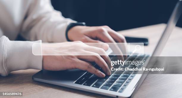 data search technology search engine optimization. man's hands are using a computer notebook to searching for information. using search console with your website. - cercare foto e immagini stock