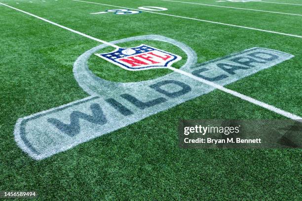 The NFL wild card logo is seen on the field prior to a game between the Miami Dolphins and Buffalo Bills in the AFC Wild Card playoff game at...