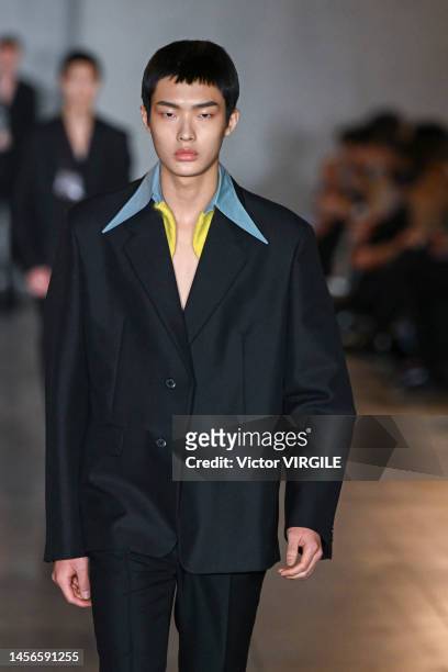 Model walks the runway during the Prada Ready to Wear Fall/Winter 2023-2024 fashion show as part of the Milan Men Fashion Week on January 15, 2022 in...