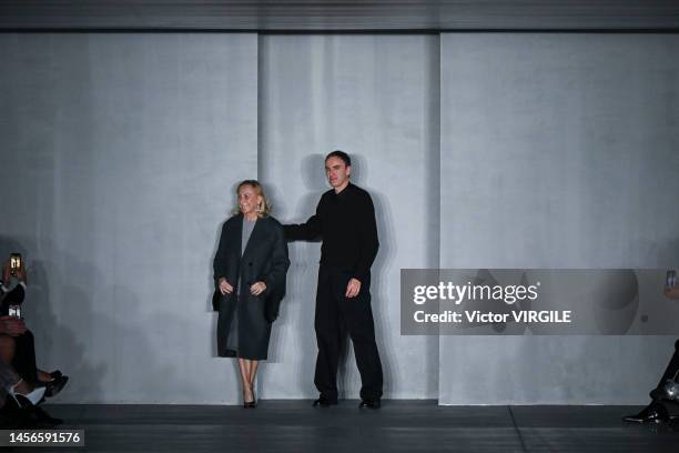 Fashion designers Miuccia Prada and Raf Simons walk the runway during the Prada Ready to Wear Fall/Winter 2023-2024 fashion show as part of the Milan...