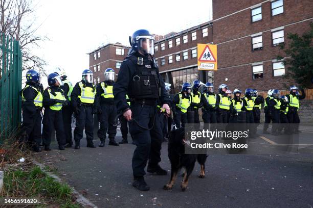 Police with a dog are seen outside the stadium prior to the Premier League match between Tottenham Hotspur and Arsenal FC at Tottenham Hotspur...