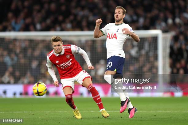 Harry Kane of Tottenham Hotspur battles for possession with Martin Odegaard of Arsenal during the Premier League match between Tottenham Hotspur and...
