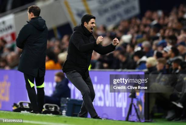 Mikel Arteta, Manager of Arsenal, celebrates after their sides first goal, an own goal by Hugo Lloris of Tottenham Hotspur during the Premier League...