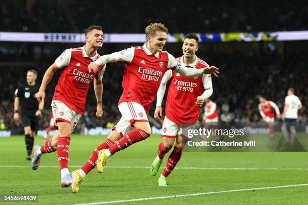 Martin Odegaard of Arsenal celebrates after scoring the team's second goal during the Premier League match between Tottenham Hotspur and Arsenal FC...