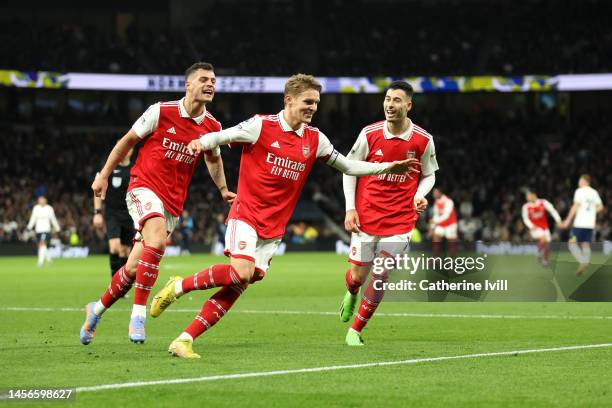 Martin Odegaard of Arsenal celebrates after scoring the team's second goal during the Premier League match between Tottenham Hotspur and Arsenal FC...