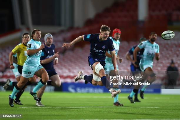 Ted Hill of Bath kicks ahead and scores a try during the Pool B Challenge Cup match between Bath Rugby and RC Toulon at Kingsholm Stadium on January...