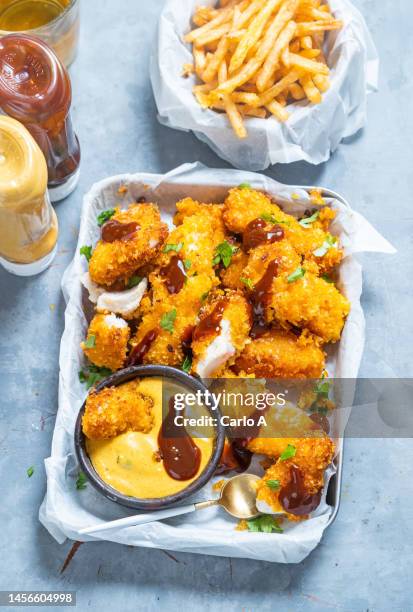 fish nuggets - cook battered fish stock pictures, royalty-free photos & images