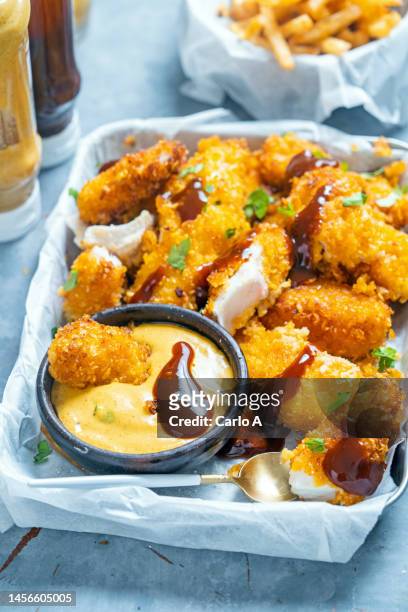 fish nuggets - cook battered fish stock pictures, royalty-free photos & images
