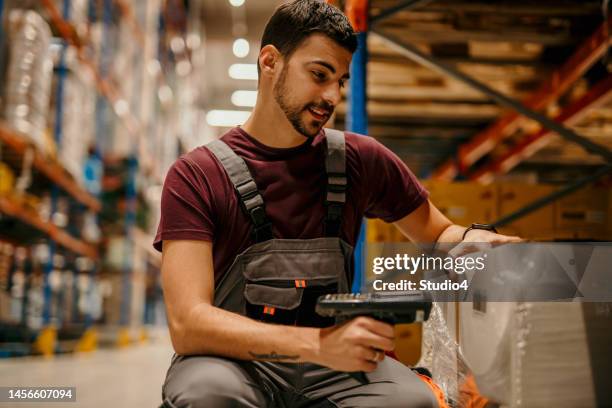 checking packages in distribution center - tag 4 stock pictures, royalty-free photos & images