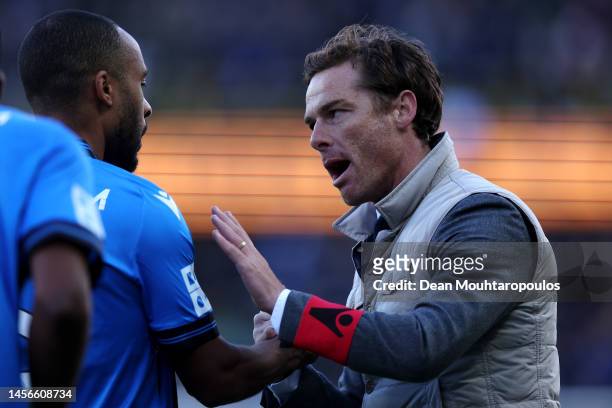 Head coach / Manager of Club Brugge, Scott Parker talks to his player Denis Odoi on the side lines during the Jupiler Pro League match between Club...