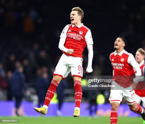 Martin Odegaard of Arsenal celebrates after the team's victory during the Premier League match between Tottenham Hotspur and Arsenal FC at Tottenham...