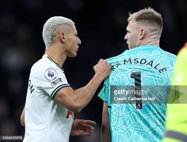 Richarlison of Tottenham Hotspur clashes with Aaron Ramsdale of Arsenal after the Premier League match between Tottenham Hotspur and Arsenal FC at...