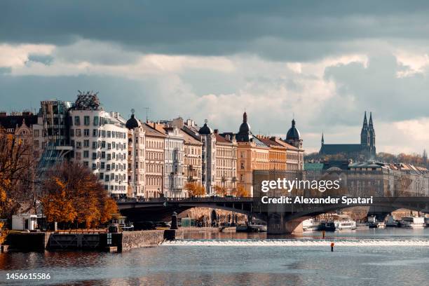prague skyline with dancing house, vysehrad basilica and vltava river, czech republic - tancici dum stock pictures, royalty-free photos & images