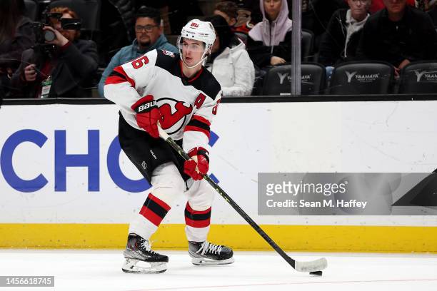 Jack Hughes of the New Jersey Devils controls the puck during the first period of a game against the Anaheim Ducks at Honda Center on January 13,...