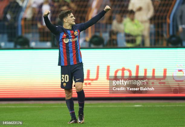 Gavi of FC Barcelona celebrates after scoring the teams first goal during the Super Copa de Espana Final match between Real Madrid and FC Barcelona...