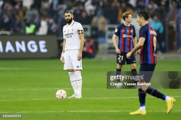 Karim Benzema of Real Madrid reacts after Robert Lewandowski of FC Barcelona scored their sides second goal during the Super Copa de Espana Final...