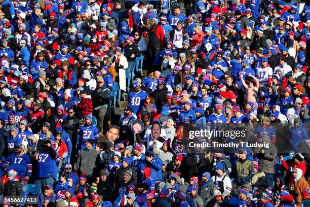 Fans look on during the first half of the game the game between the Miami Dolphins and Buffalo Bills in the AFC Wild Card playoff game at Highmark...