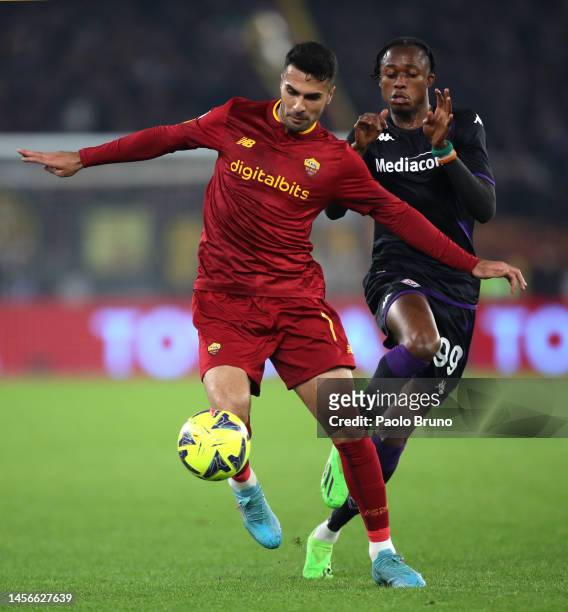 Zeki Celik of AS Roma battles for possession with Cristian Kouame of ACF Fiorentina during the Serie A match between AS Roma and ACF Fiorentina at...