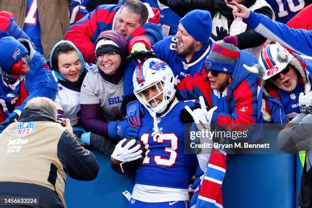 Gabe Davis of the Buffalo Bills celebrates with fans after catching a touchdown pass against the Miami Dolphins during the third quarter of the game...