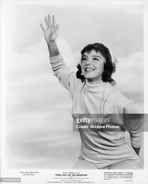 Janet Munro raises her hand in publicity portrait for the film 'Third Man On The Mountain', 1959.