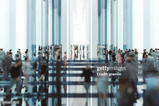 modern glass office lobby with business people - lobbyen stockfoto's en -beelden