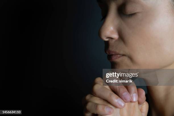 praying woman - please use this photo not the other one stock pictures, royalty-free photos & images