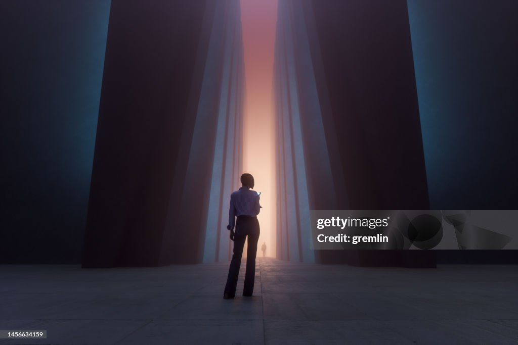 Woman walking in futuristic brutalist city street