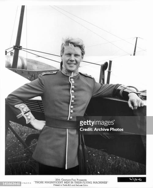 James Fox leaning against his plane in a scene from the film 'Those Magnificent Men In Their Flying Machines Or How I Flew From London To Paris In 25...