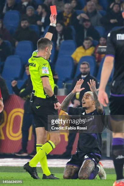 Dodo of ACF Fiorentina is shown the red card from the referee during the Serie A match between AS Roma and ACF Fiorentina at Stadio Olimpico on...