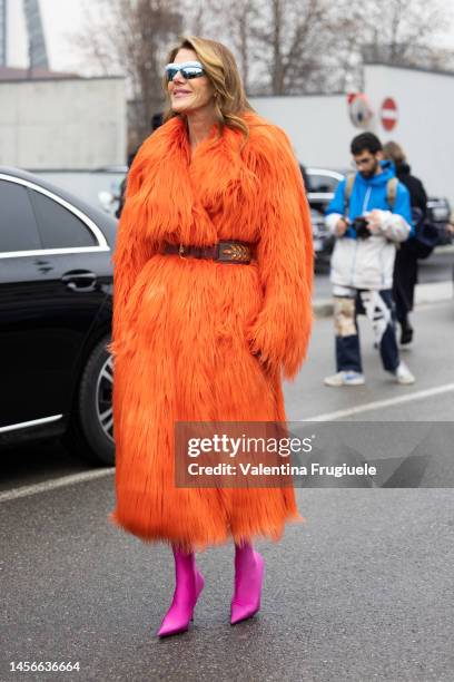 Anna dello Russo is seen wearing an orange fur coat and pink boots outside the Etro show during the Milan Menswear Fall/Winter 2023/2024 on January...