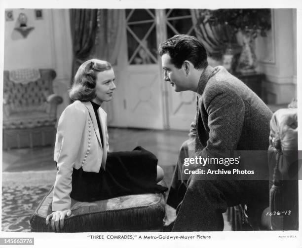 Margaret Sullavan looking into the eyes of Robert Taylor in a scene from the film 'Three Comrades', 1938.