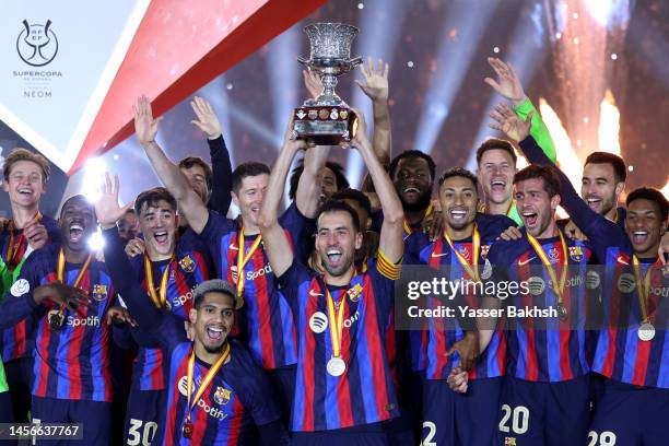 Sergio Busquets of FC Barcelona lifts the Super Copa de Espana trophy after the team's victory during the Super Copa de Espana Final match between...