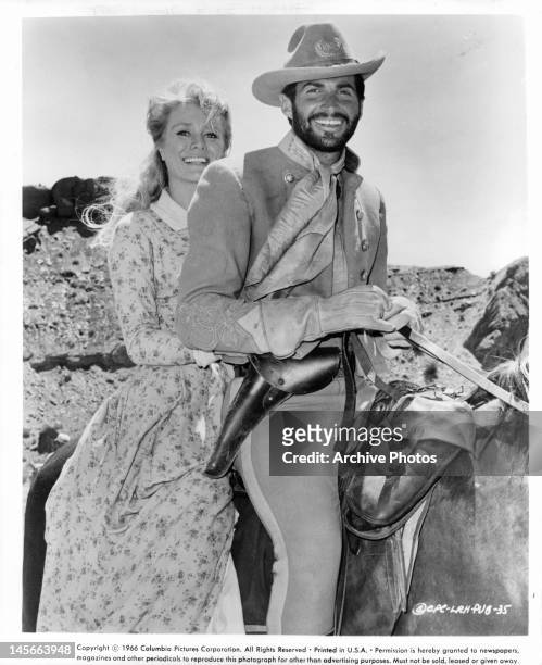 Inger Stevens and George Hamilton take time off from filming to enjoy a horseback ride together between scenes from the film 'A Time For Killing',...