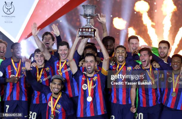 Sergio Busquets of FC Barcelona lifts the Super Copa de Espana trophy after the team's victory during the Super Copa de Espana Final match between...