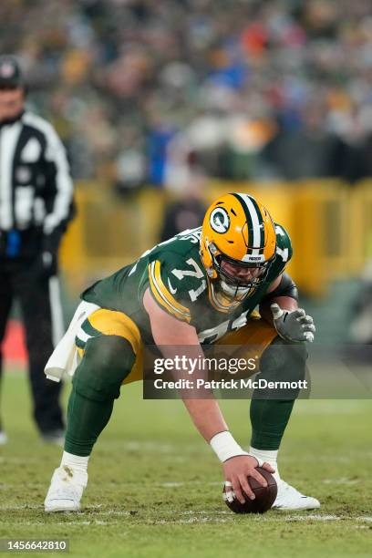 Josh Myers of the Green Bay Packers prepares to snap the ball at the line of scrimmage in the first half against the Detroit Lions at Lambeau Field...