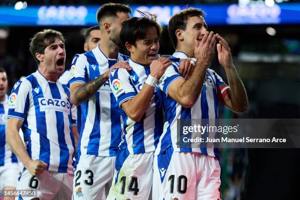 Mikel Oyarzabal of Real Sociedad celebrates with his teammates Brais Mendez, Aritz Elustondo and Takefusa Kubo of Real Sociedad after scoring his...