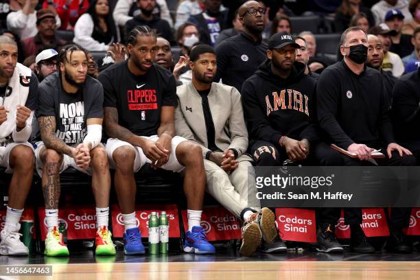 Paul George of the LA Clippers looks on from the bench during the second half of a game against the Houston Rockets at Crypto.com Arena on January...