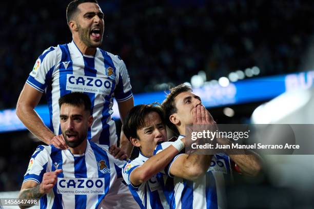 Mikel Oyarzabal of Real Sociedad celebrates with his teammates Brais Mendez, Mikel Merino and Takefusa Kubo of Real Sociedad after scoring his team's...