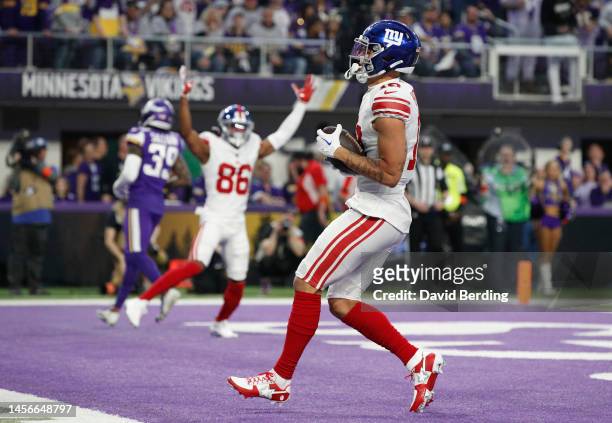 Isaiah Hodgins of the New York Giants catches a touchdown pass during the first quarter against the Minnesota Vikings in the NFC Wild Card playoff...