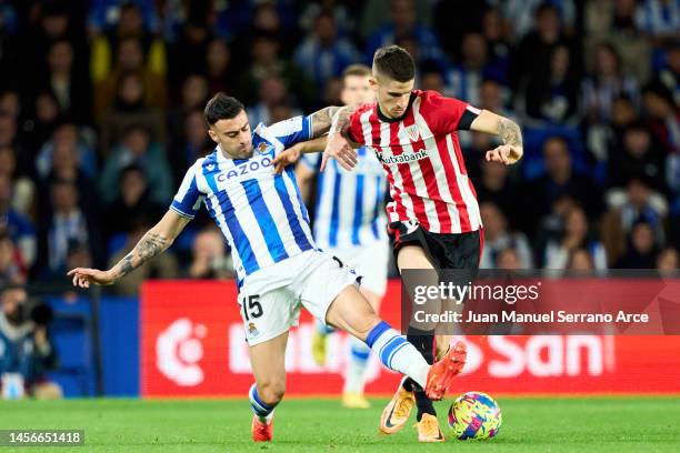 Oihan Sancet of Athletic Club duels for the ball with rs1 of Real Sociedad during the LaLiga Santander match between Real Sociedad and Athletic Club...