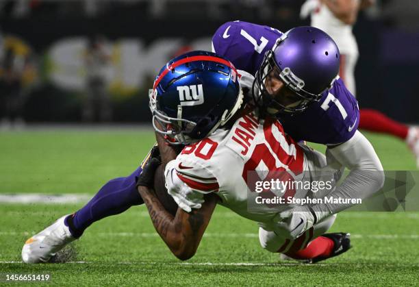 Patrick Peterson of the Minnesota Vikings tackles Richie James of the New York Giants during the second quarter in the NFC Wild Card playoff game at...