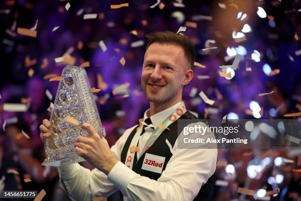 Judd Trump of England celebrates with the Paul Hunter trophy following his victory in the Cazoo Masters Final against Mark Williams of Wales at...