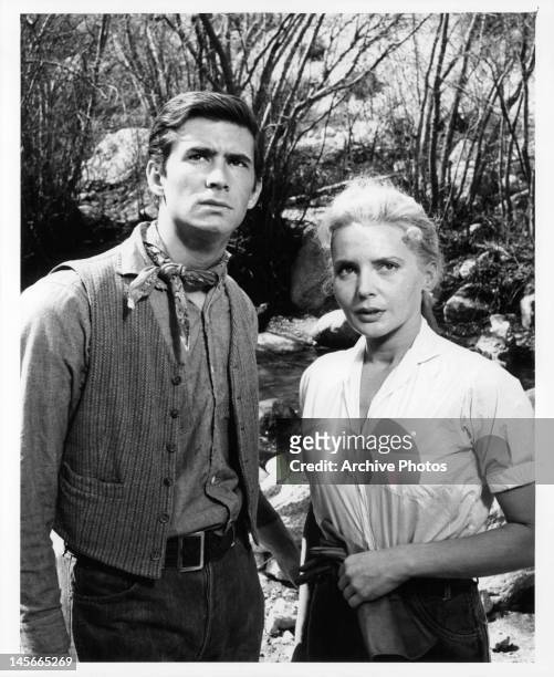 Anthony Perkins and Elaine Aiken have serious look as they look up outside in a scene from the film 'The Lonely Man', 1957.